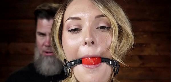  Blonde slave in suspension is whipped